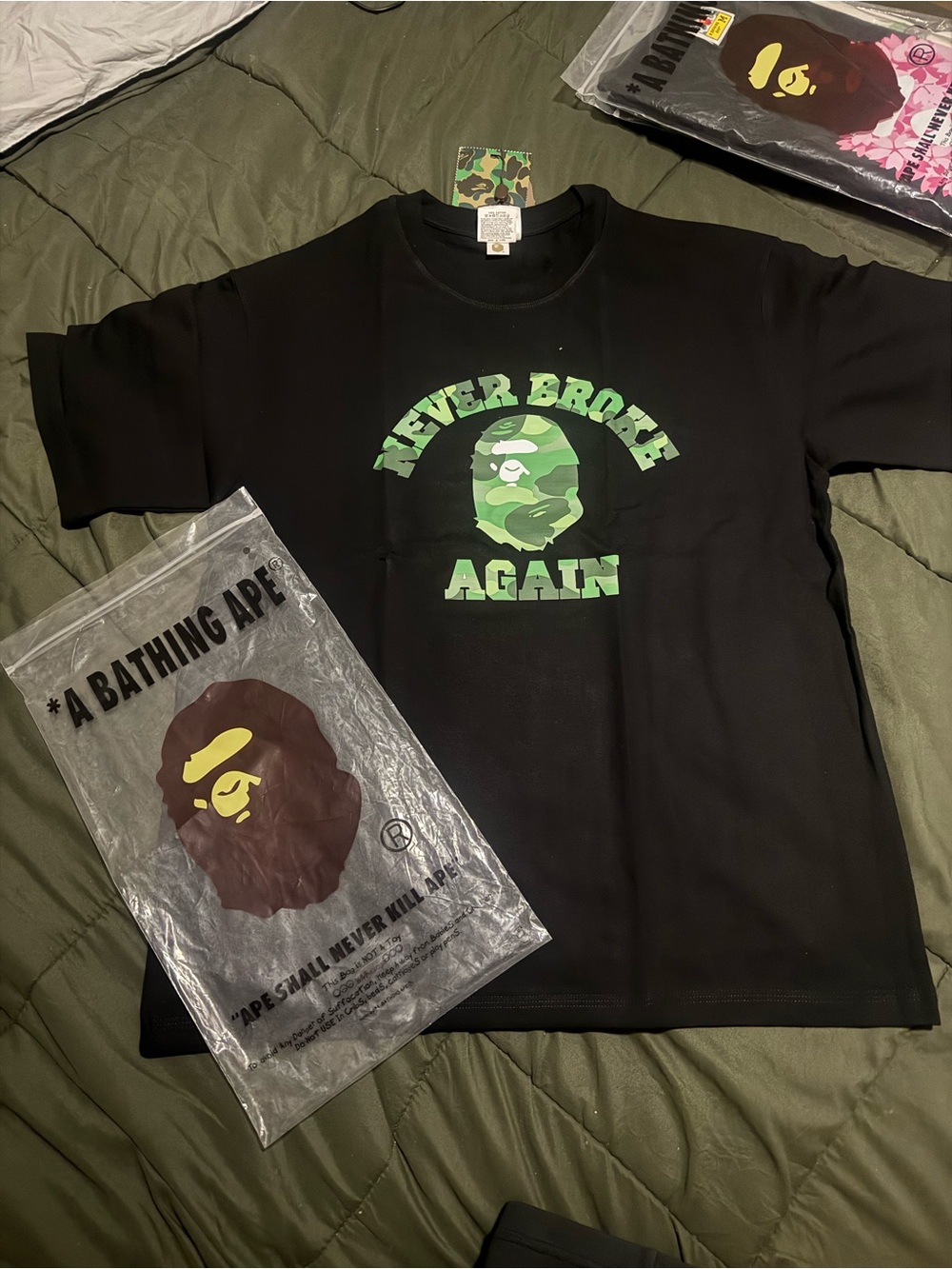 A Bathing Ape Never Broke Again' Black Tee with Green Camo Logo